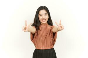 Showing Peace Sign Of Beautiful Asian Woman Isolated On White Background photo