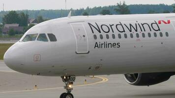 MOSCOW, RUSSIAN FEDERATION - JULY 29, 2021. Airbus A321, VQ-BOD of Nordwind Airlines on the taxiway of Sheremetyevo airport. Board turns towards the terminal after landing video