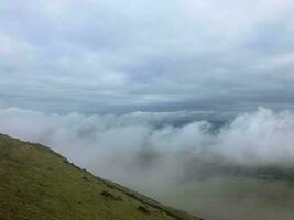 A view of the Caradoc Hills in Shropshire on a misty morning photo