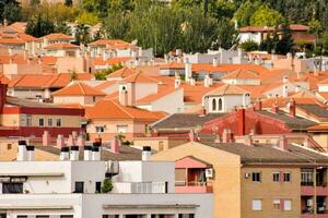 a city with many red and orange tiled roofs photo