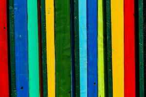 a colorful wall with many different colored wooden boards photo