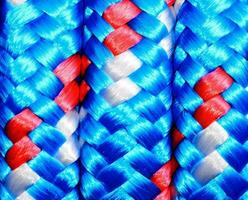 a close up of blue, red and white braided ropes photo