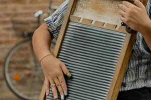 a person holding a wash board photo