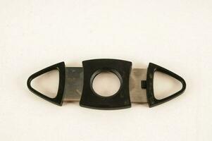 a black cigar cutter photo