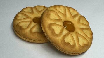 Pineapple jam biscuits, cookie neatly arranged and photographed on a plain white background photo