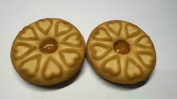 Pineapple jam biscuits, cookie neatly arranged and photographed on a plain white background photo