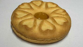 Pineapple jam biscuits, cookie neatly arranged and photographed on a plain white background photo