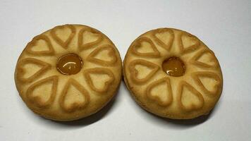 Pineapple jam biscuits, cookie neatly arranged and photographed on a plain white background photo