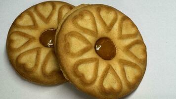 Pineapple jam biscuits, cookie neatly arranged and photographed on a plain white background photo