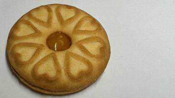 Pineapple jam biscuits, cookie neatly arranged and photographed on a plain white background photo