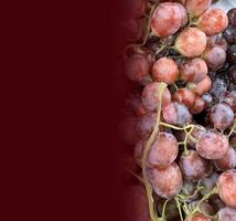 Close up of raw organic sweet red grapes background, wine grapes texture, Healthy fruits Red wine grapes background, top view photo