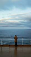 AI generated A serene image of a lone figure standing on the deck of a cruise ship photo