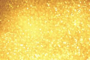 Golden sparkle glitters with bokeh effect and selectieve focus. Festive background with bright gold lights, champagne bubble. Christmas mood concept. Copy space, close up, texture, top view. photo