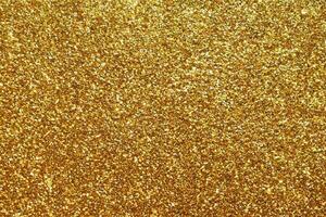 Abstract gold glitter sparkle background photo