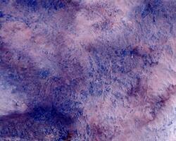 Abstract hand painted violet blue, purple watercolor on textured background photo