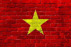 Flag of Socialist Republic of Vietnam on a textured background. Concept collage. photo