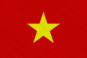 Flag of Socialist Republic of Vietnam on a textured background. Concept collage. photo