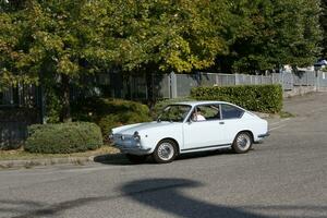 Bibbiano-Reggio Emilia Italy 07 15 2015 Free rally of vintage cars in the town square Fiat 850 Coupe photo