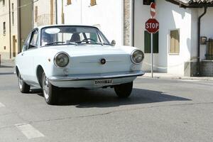 Bibbiano-Reggio Emilia Italy 07 15 2015 Free rally of vintage cars in the town square Fiat 850 Coupe photo