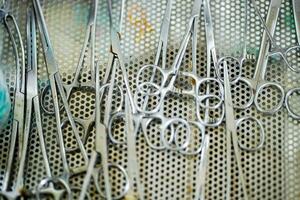 Closeup medical tools and scissors for dressing wounds of veterinary in clinic photo