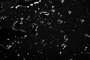 Abstract water spread  with reflection lightning on black background. photo