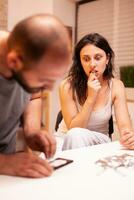 Woman getting stoned with crack cocaine in home. Amphetamine abuse with side effects suffers from pain making seizures, social disaster and narcotics addiction epidemic. photo