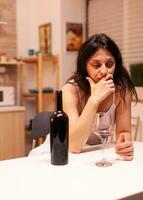 Depressed divorced woman being disappointed with men in her life having problem alcohol abuse. Unhappy person disease and anxiety feeling exhausted with having alcoholism problems. photo