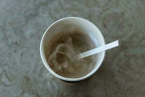 Morning coffee in paper glass. photo