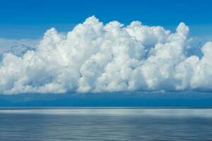 White cloud over the lake with blue sky. photo
