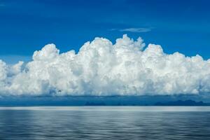 White cloud over the lake with blue sky. photo