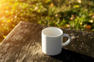 White coffee mug in the morning time photo