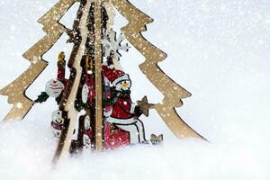 snowman on the Christmas tree and abstract snow fall. Winter holidays concept. photo