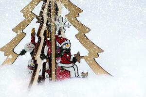 snowman on the Christmas tree and abstract snow fall. Winter holidays concept. photo