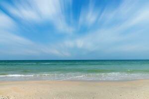 Green water in the sea on the beach. photo