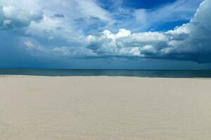 Sand and cloud sky on the beach. photo