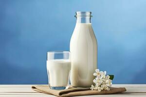 AI generated A bottle of milk and a glass of milk on a wooden table on a blue background. AI Generated photo