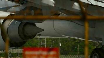 Huge airplane jet engine close up view moving forward heat haze. Landing gear video