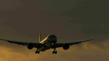 Jet airplane approaching to land in the sunset sky, long shot static. Tourism and travel concept video