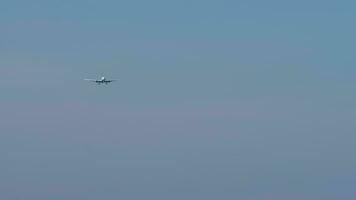 Unrecognizable passenger plane approaching to land, view from below. Concept tourism and travel video