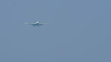 Airplane approaching landing, long shot. Jet plane in the sky. Passenger aircraft flies, front view video