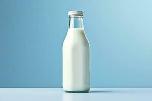 AI generated A glass bottle with full milk on blue background. AI Generated photo