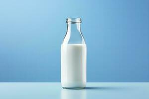 AI generated A glass bottle with full milk on blue background. AI Generated photo