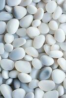 AI generated vertical pebbles texture background, closeup white smooth stones photo