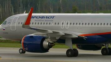 MOSCOW, RUSSIAN FEDERATION - JULY 29, 2021. Airplane Airbus A320, VP-BPM of Aeroflot taxiing at Sheremetyevo airport, side view. Concept aviation video