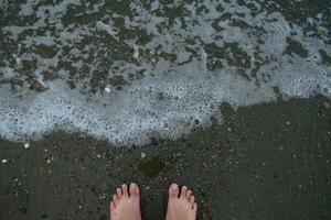 Banda Aceh beach, facing the edge of rippling sea water photo