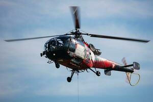 Zeltweg, Austria, 2022 - Austrian Air Force Aerospatiale Alouette III. Military transport helicopter at air base. Aviation and rotorcraft. Transport and airlift. Military industry. Fly and flying. photo