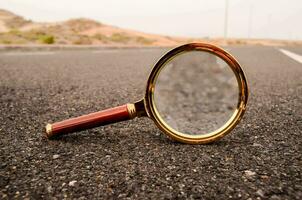 magnifying glass on the road photo