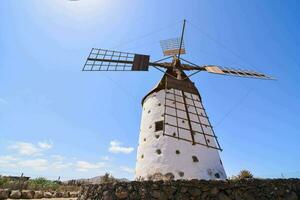 a windmill on a sunny day photo