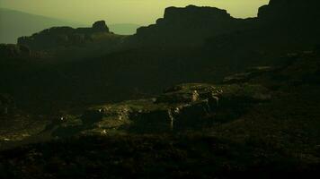 A view of a rocky mountain with a green sky in the background video