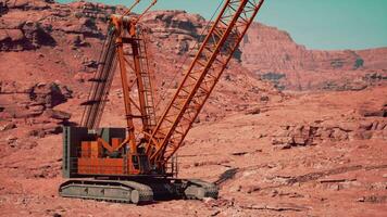 A large crane sitting in the middle of a desert video